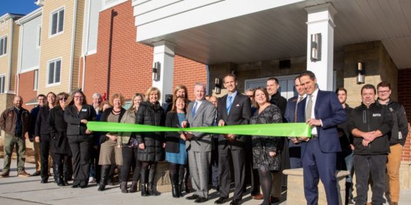 Village officials, developers, builders, funders, future tenants, and members of the public gather to officially cut the ribbon and open Cary Senior Living, a new 62 unit affordable housing rental community for residents aged 62 and older.