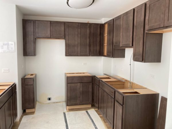 Kitchen cabinets have been installed.
