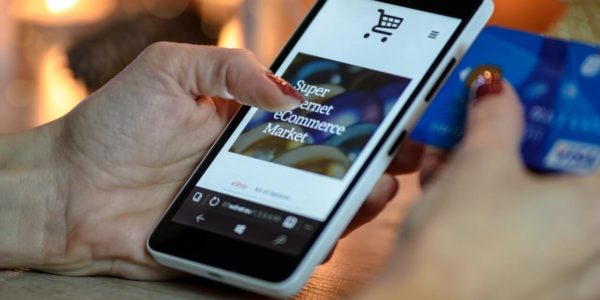 woman shopping online using mobile phone