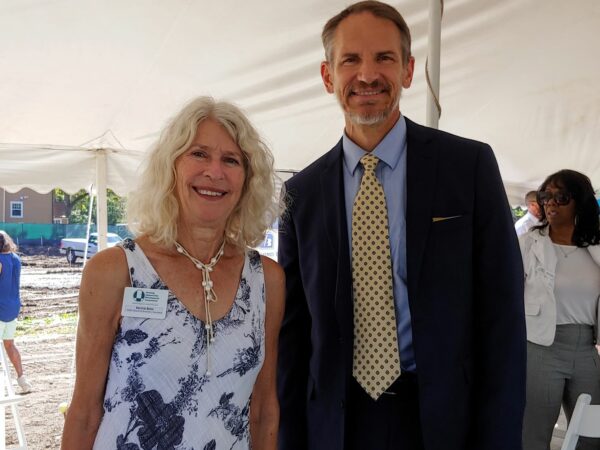 Two people smiling at the camera