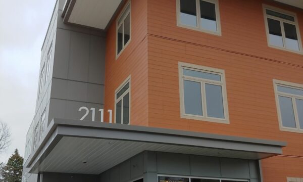 Three story apartment building.