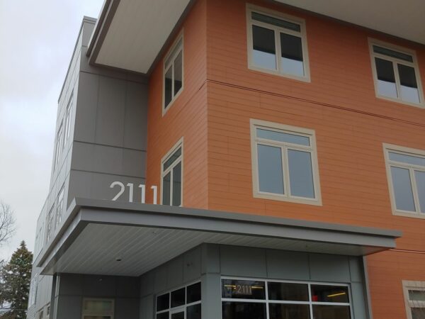 Three story apartment building.