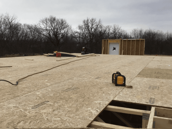 Construction site showing the second floor deck that is open to the sky.