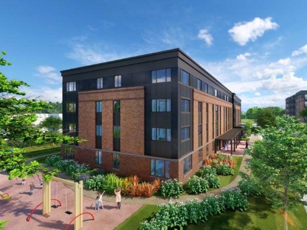 Drawing of four story apartment building with blue sky, green trees and children playing on a small playground.