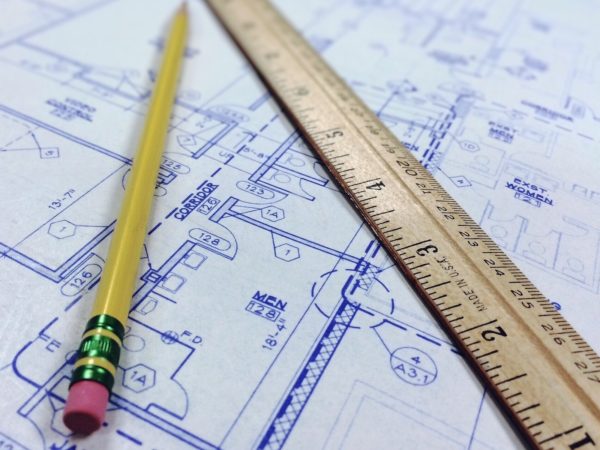 Blueprint with a wooden ruler and a pencil.