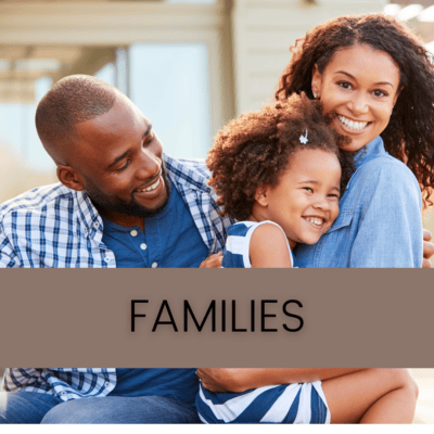 Families: A black couple smiling with the woman holding a young girl.