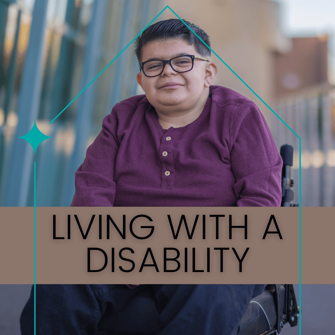 Latino person in a wheelchair, wearing dark framed glasses and a maroon shirt.