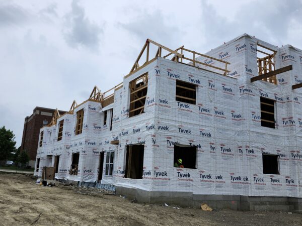 A three story building under construction.