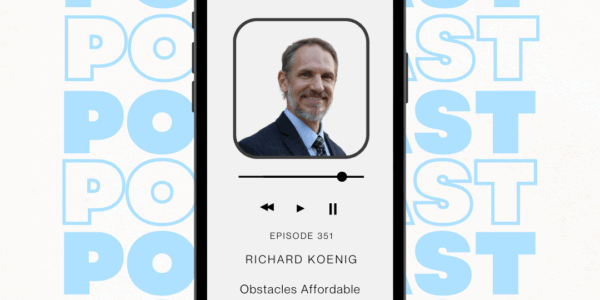 A white man smiling in a picture on a smart phone screen. The word "Podcast" repeats in light blue and white in the background.