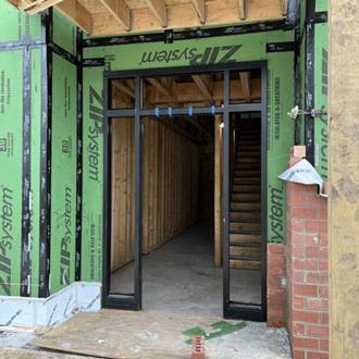 An entry doorway to a building is under construction.