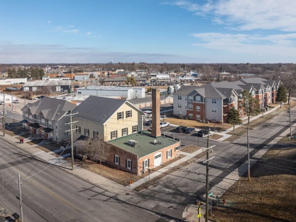Aerial view of Taylor Place Apartments affordable housing community in a suburban area.